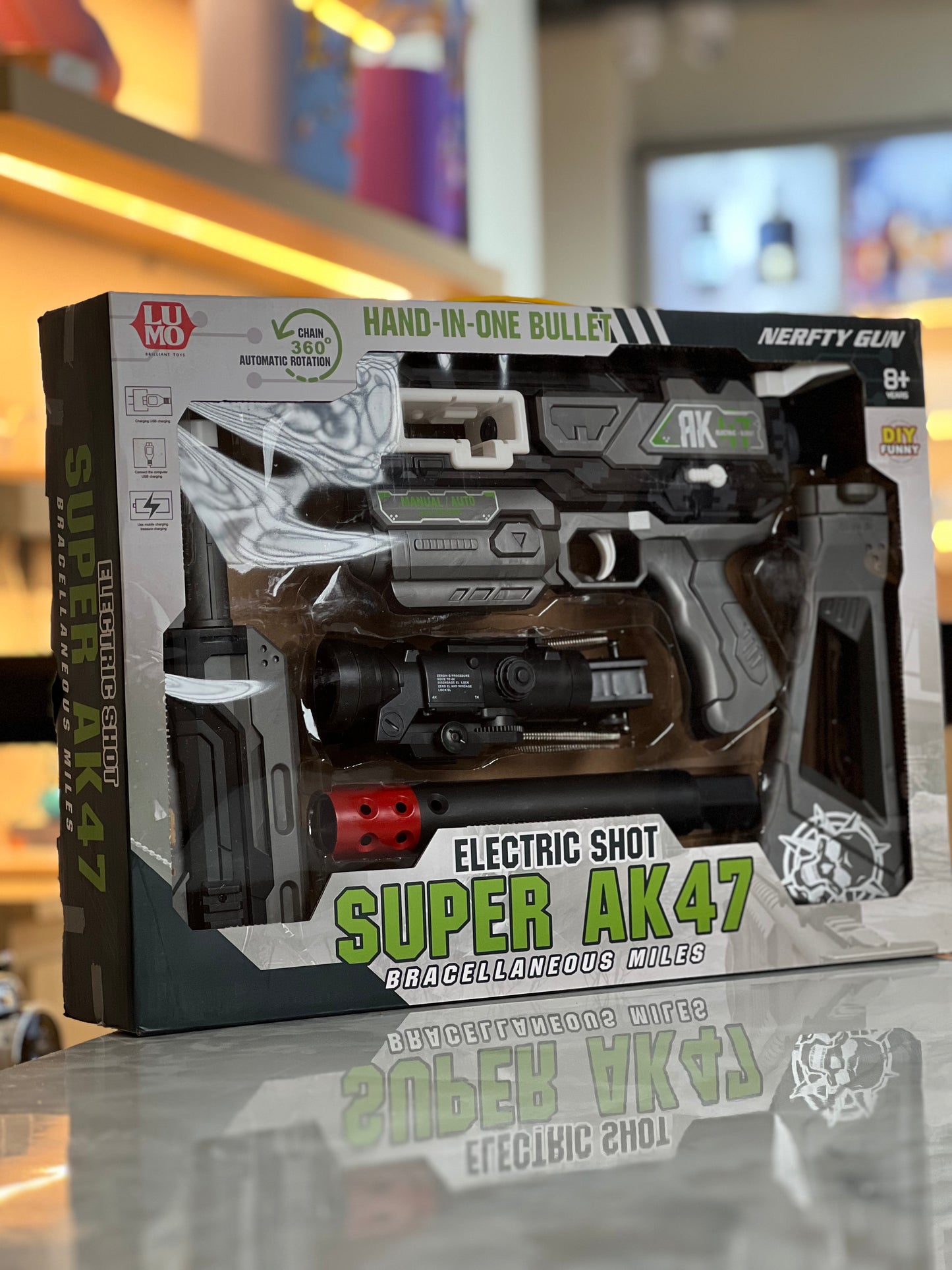 “AK47” styling, the Nerf-style play compatibility, and the target age, making it clear and attractive for shoppers.