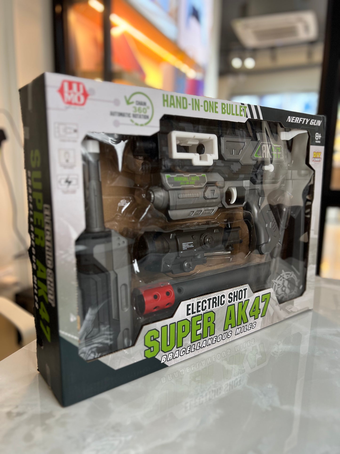 “AK47” styling, the Nerf-style play compatibility, and the target age, making it clear and attractive for shoppers.